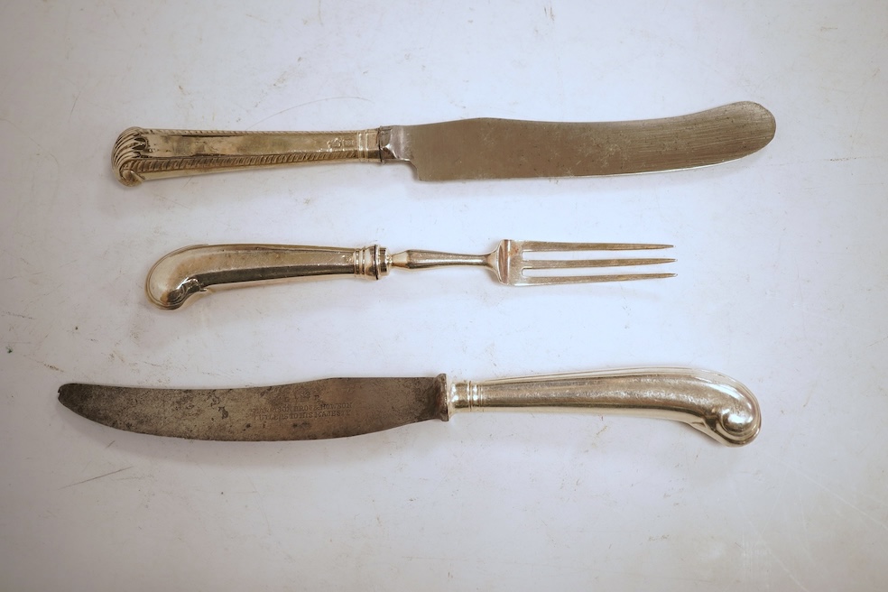 A collection of eleven Georgian silver, white metal or agate handled steel bladed knives, differing sizes, the largest 25cm, together with a set of eleven George III silver pistol handled dessert forks by Moses Brent, Lo